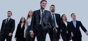 Business team leaders in formal attire confidently walking forward